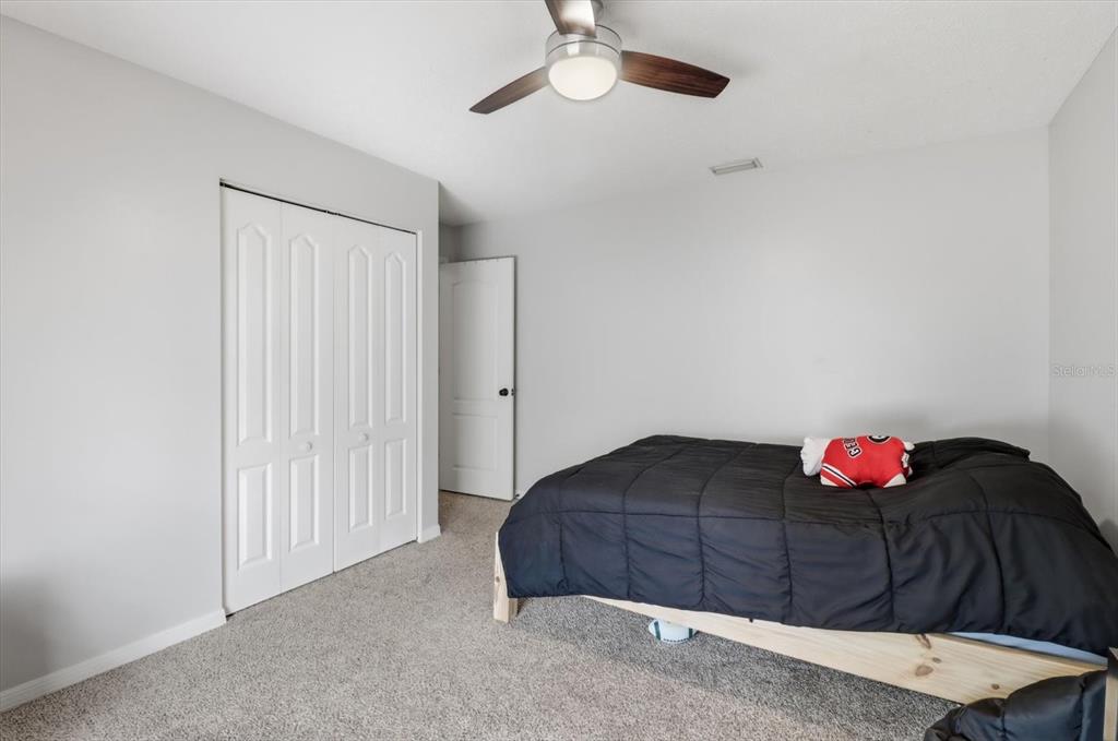 3189 South Graymor Path Inverness, FL 34450 - Photo 26 of 46 a bedroom with a bed and a window