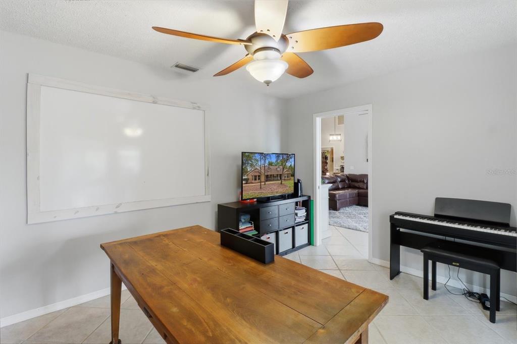 3189 South Graymor Path Inverness, FL 34450 - Photo 28 of 46 a living room with furniture and a flat screen tv