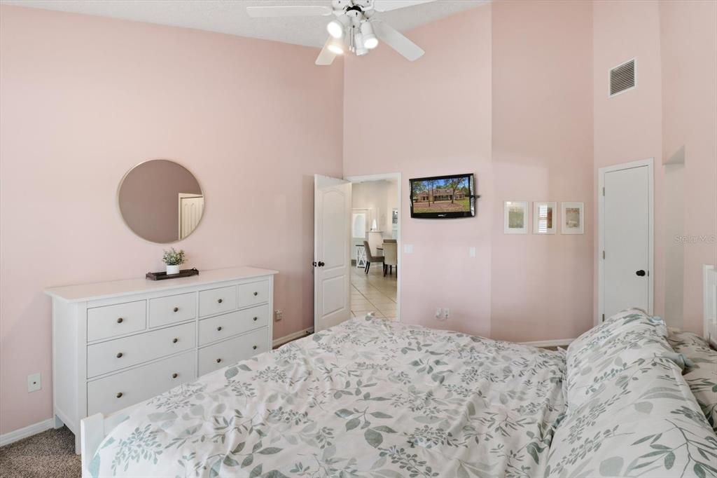 3189 South Graymor Path Inverness, FL 34450 - Photo 30 of 46 a bedroom with a bed and a dresser