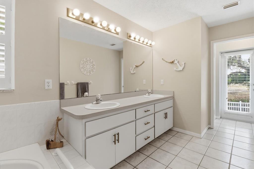 3189 South Graymor Path Inverness, FL 34450 - Photo 31 of 46 a spacious bathroom with a double vanity sink mirror and double