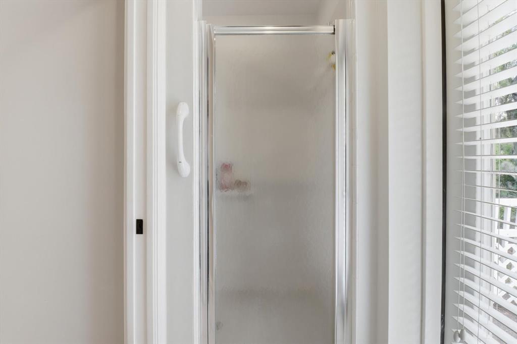 3189 South Graymor Path Inverness, FL 34450 - Photo 33 of 46 a bathroom with a glass shower door