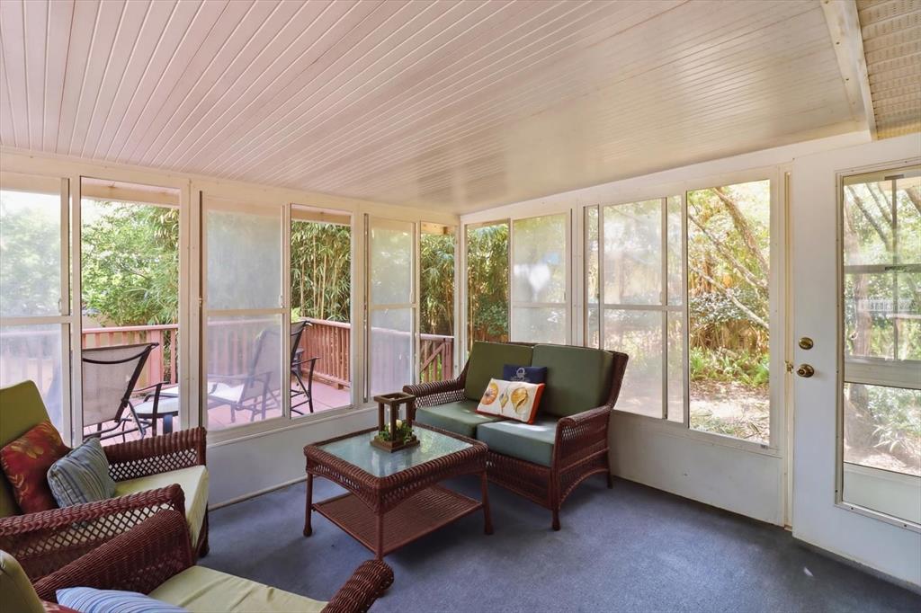 3189 South Graymor Path Inverness, FL 34450 - Photo 37 of 46 a living room with furniture and a floor to ceiling window