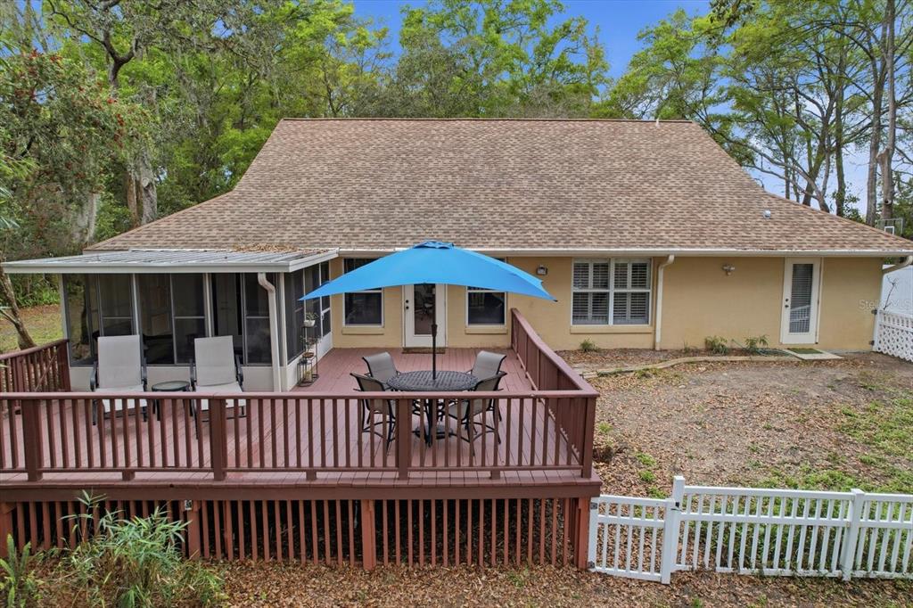 3189 South Graymor Path Inverness, FL 34450 - Photo 42 of 46 a side view of a house that has a deck