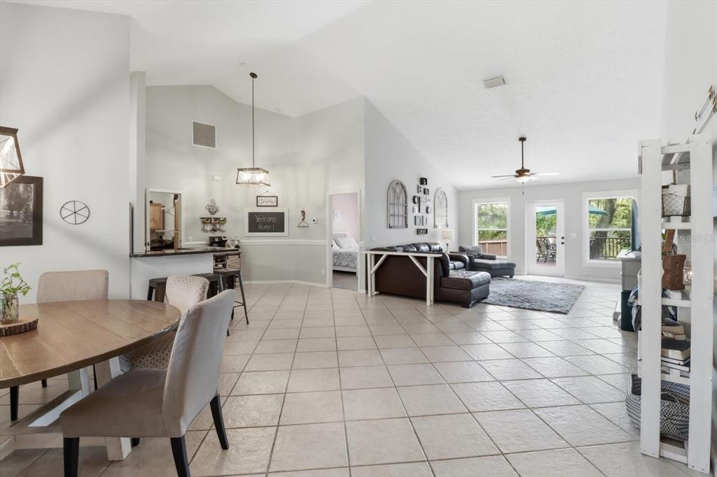 3189 South Graymor Path Inverness, FL 34450 - Photo 7 of 46 a living room with furniture and a chandelier