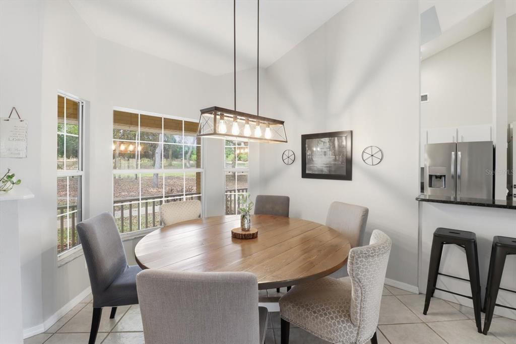 3189 South Graymor Path Inverness, FL 34450 - Photo 8 of 46 a view of a dining room with furniture and wooden floor
