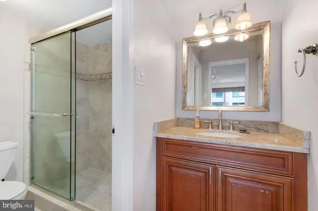 a bathroom with a sink vanity and a mirror