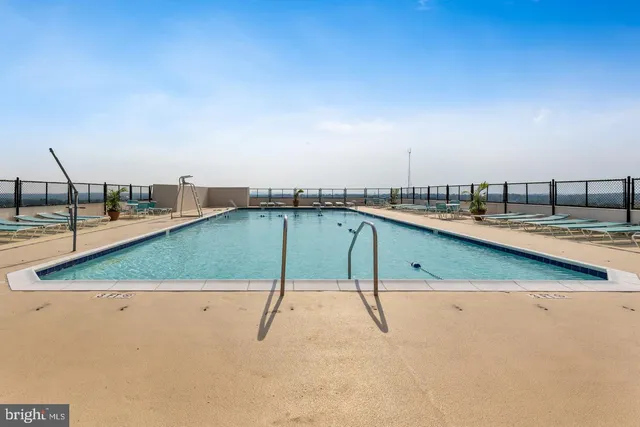 a view of a swimming pool and an outdoor space