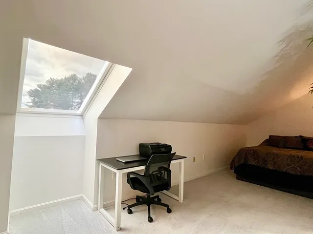 a workspace with furniture and a window