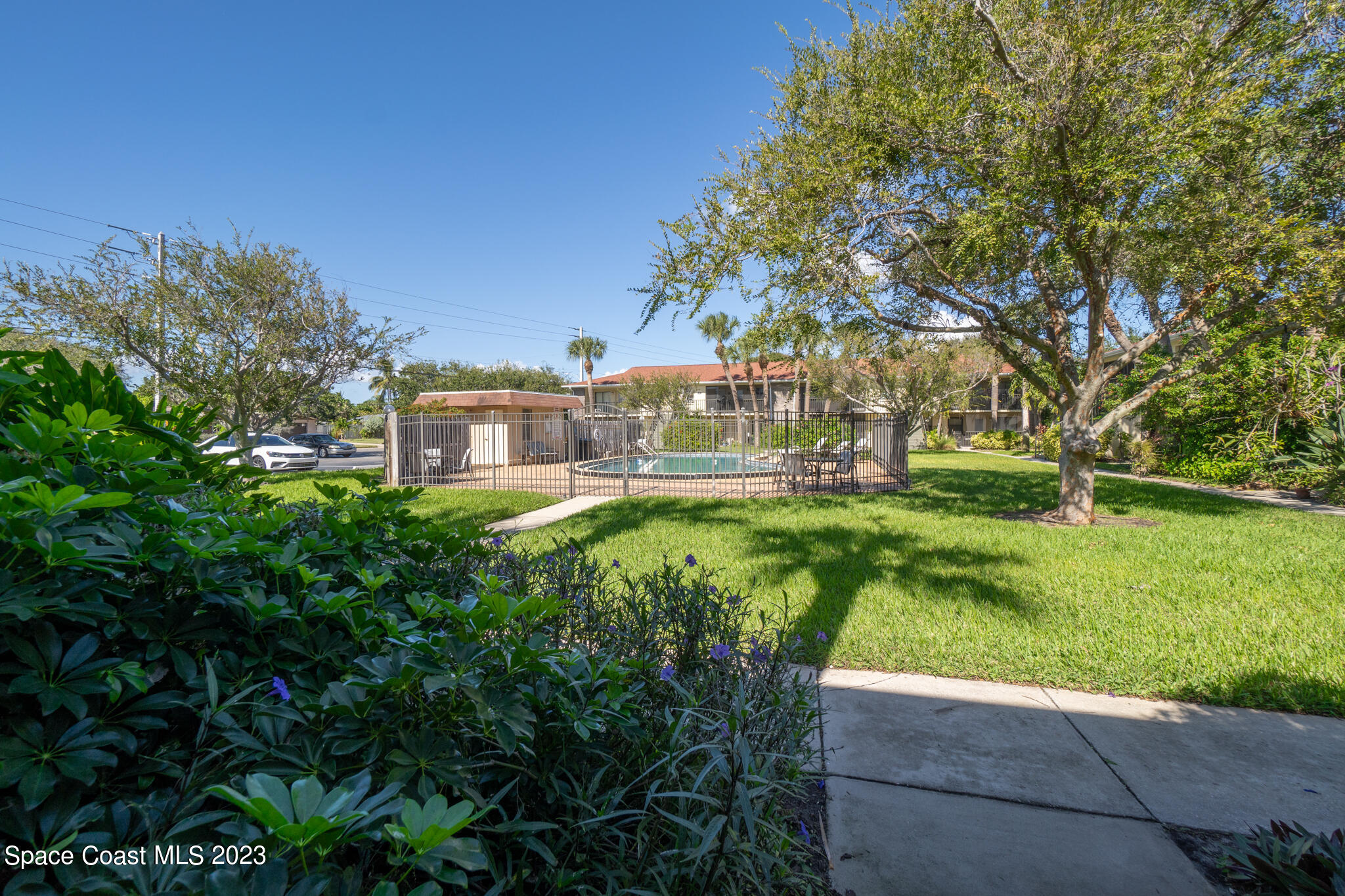500 Catalina Road, Unit 103 Cocoa Beach, FL 32931 - Photo 27 of 28 a view of a house with a big yard