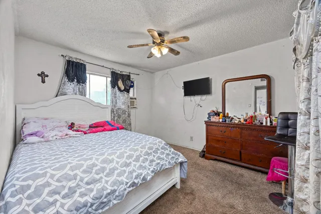 a living room with furniture and a book shelf