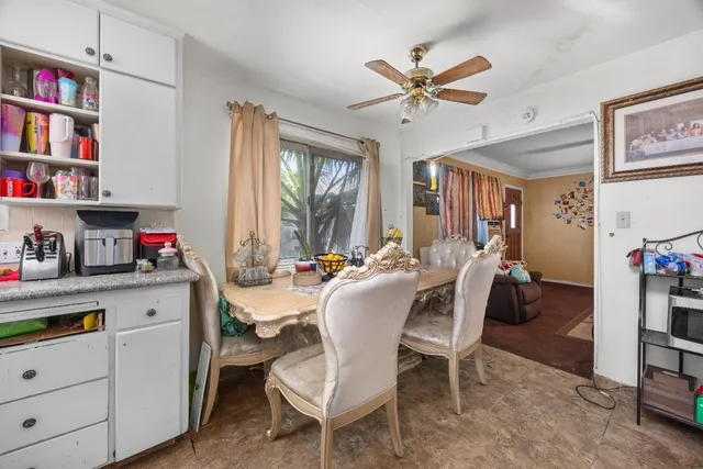 a dining room with furniture and window