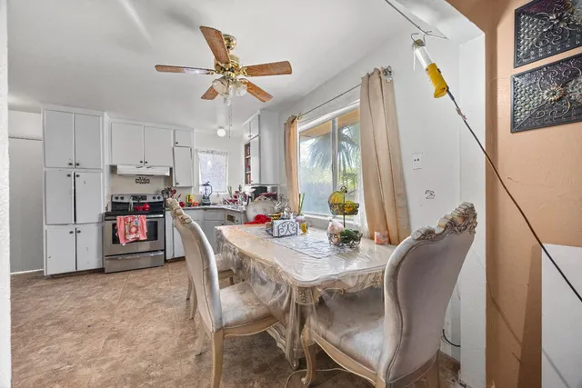 a kitchen with a sink and a stove top oven