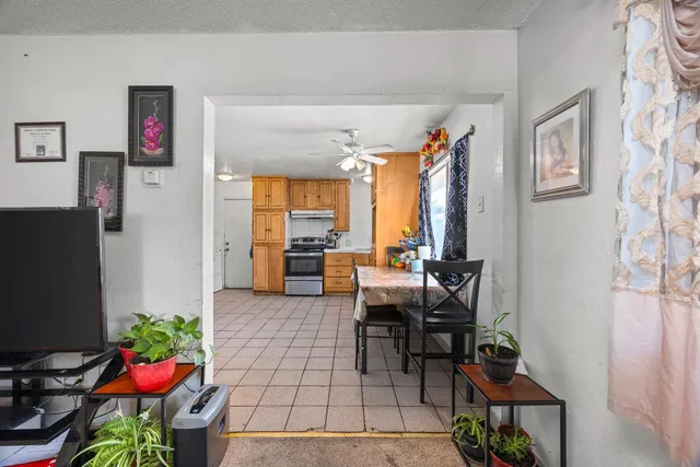a kitchen with a stove a sink and a refrigerator