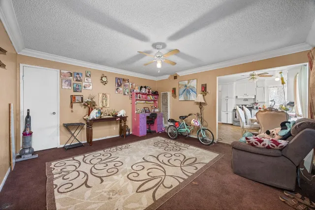 a bedroom with furniture and a wooden floor