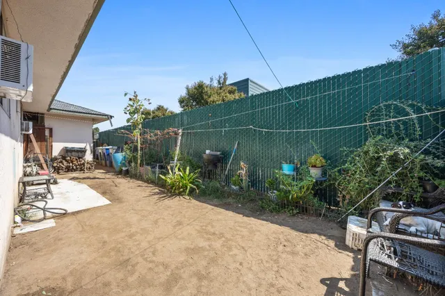 a view of a house with a yard porch and sitting area