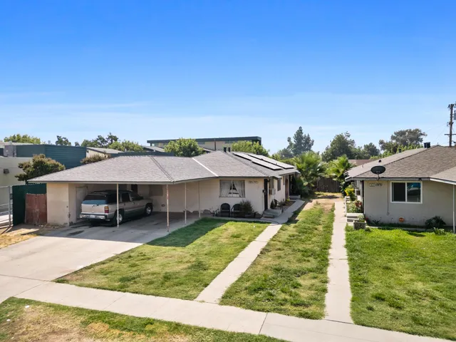 an aerial view of city and lake