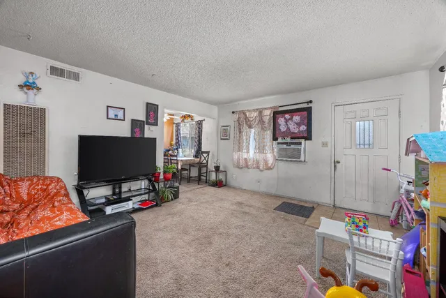 a bed room with a bed window and a chair