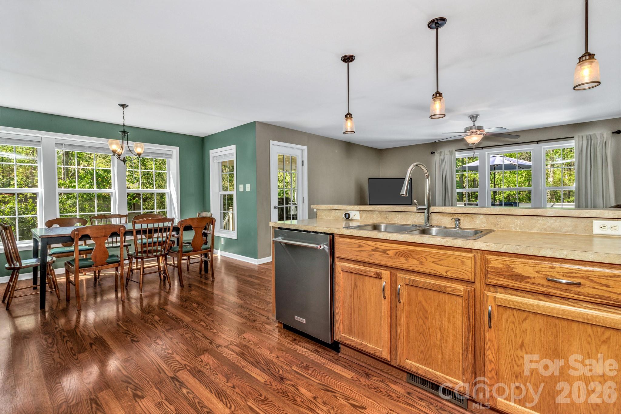 152 Joe Jenkins Road Fairview, NC 28730 - Photo 14 of 44 a kitchen with lots of counter space and a wooden floor