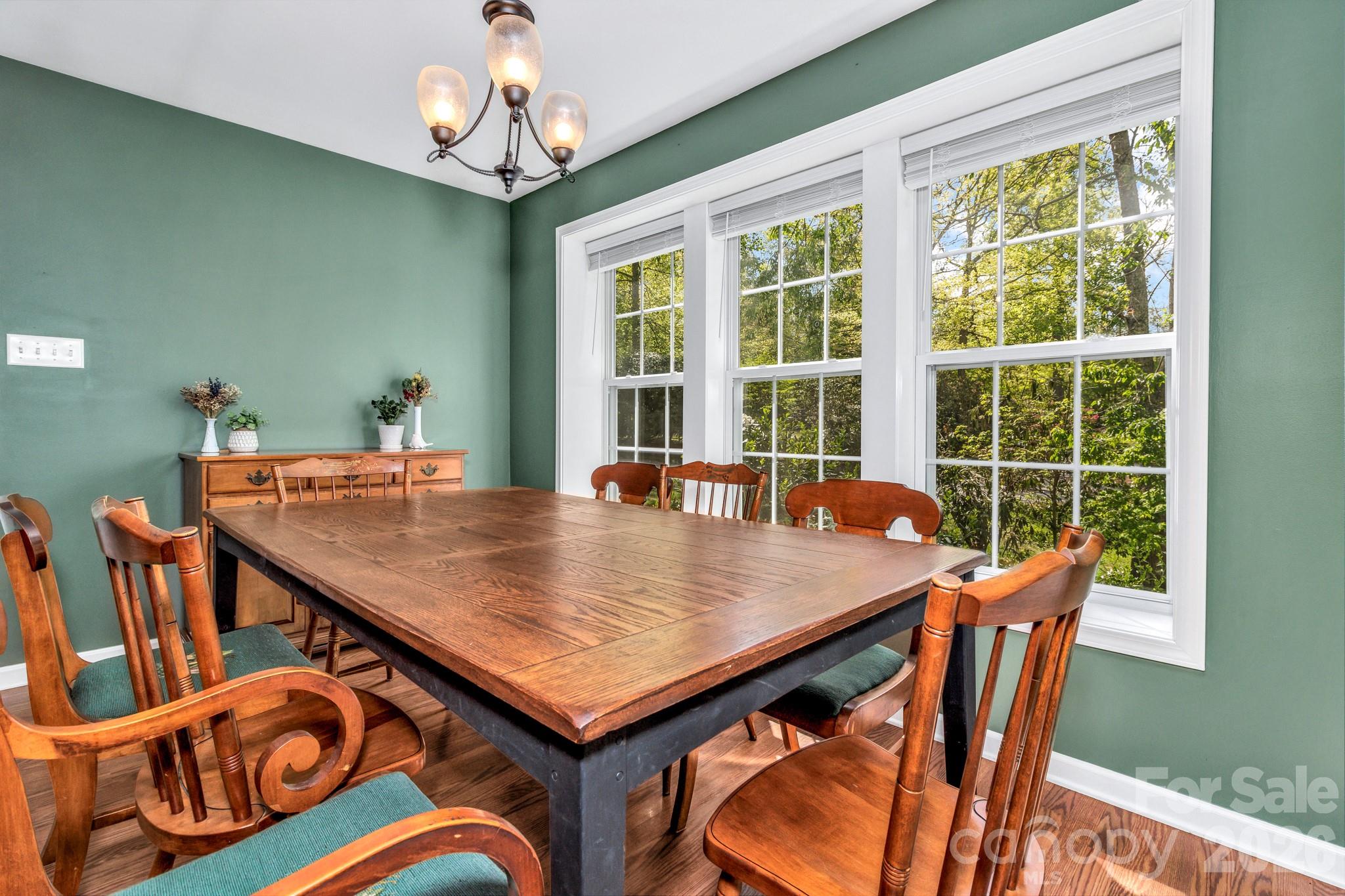 152 Joe Jenkins Road Fairview, NC 28730 - Photo 17 of 44 a view of a dining room with furniture window and outside view