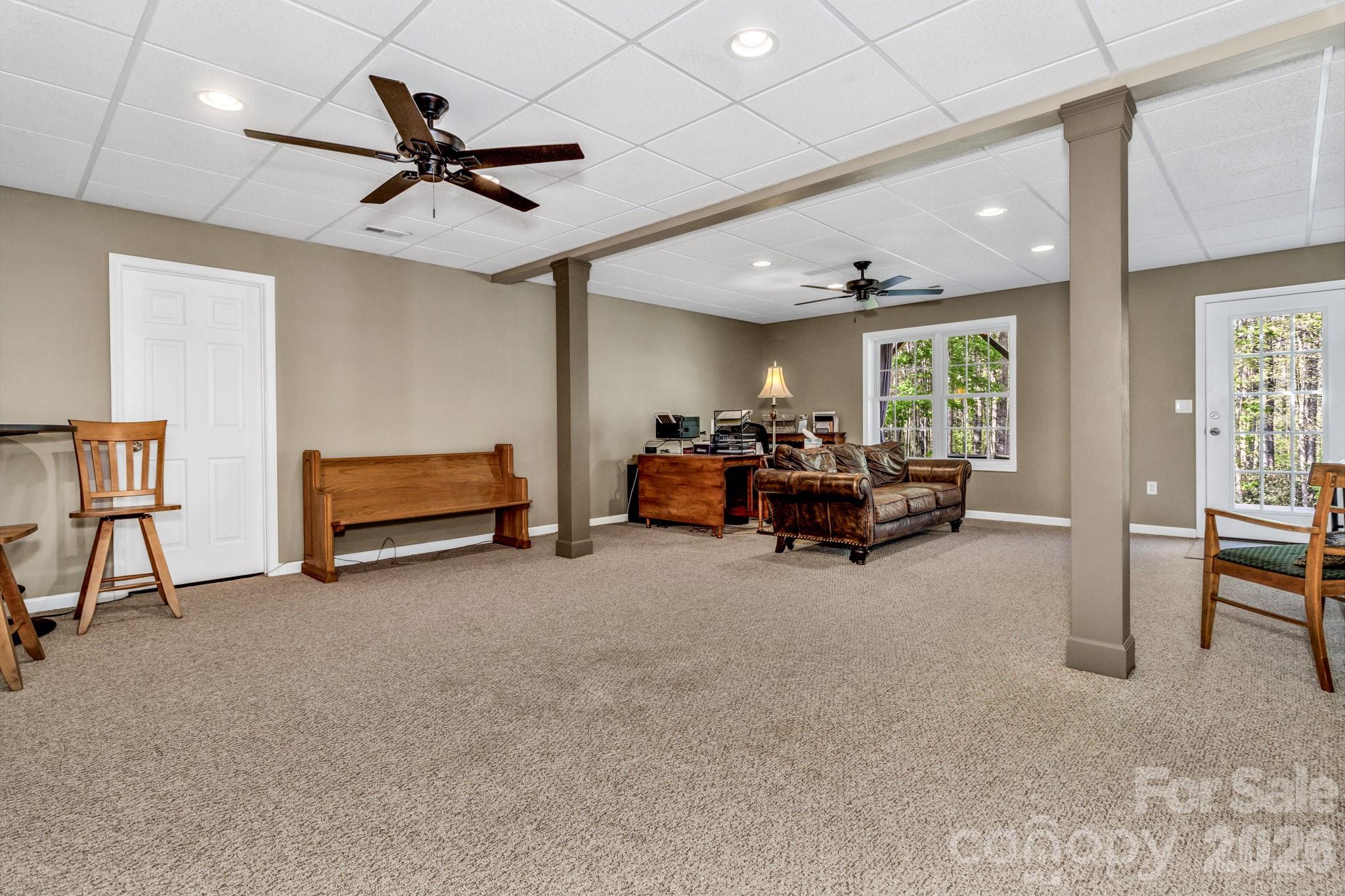 152 Joe Jenkins Road Fairview, NC 28730 - Photo 26 of 44 a living room with furniture and a large window