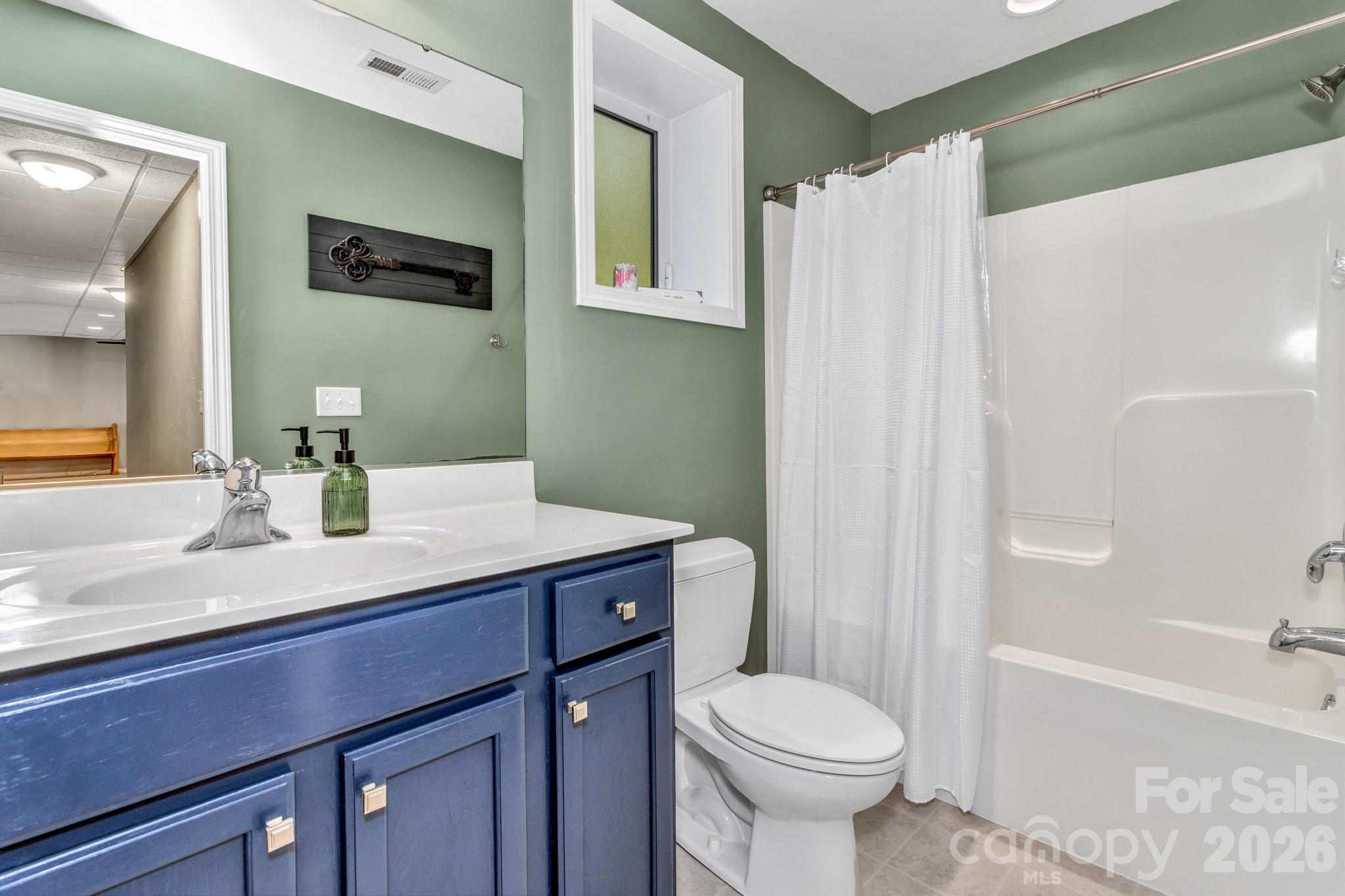 152 Joe Jenkins Road Fairview, NC 28730 - Photo 30 of 44 a bathroom with a sink toilet and shower
