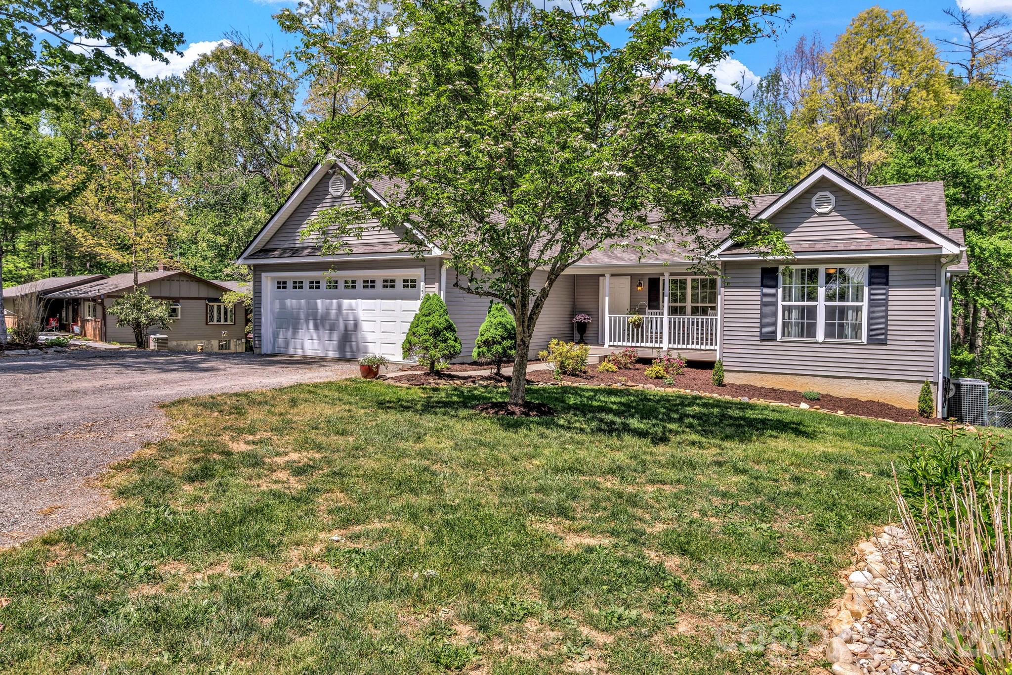 152 Joe Jenkins Road Fairview, NC 28730 - Photo 3 of 44 front view of a house with a yard