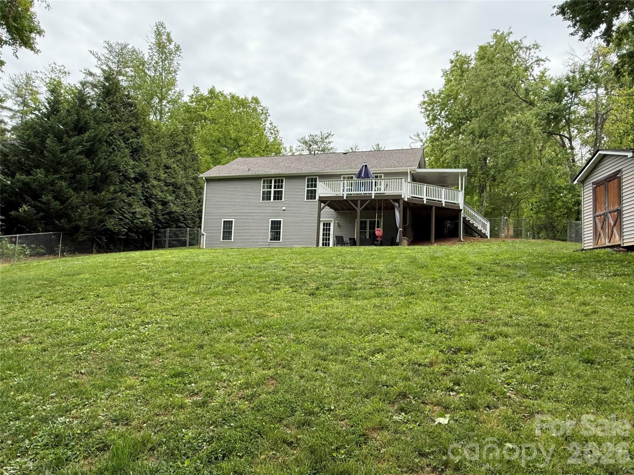 152 Joe Jenkins Road Fairview, NC 28730 - Photo 39 of 44 a view of a house with a yard