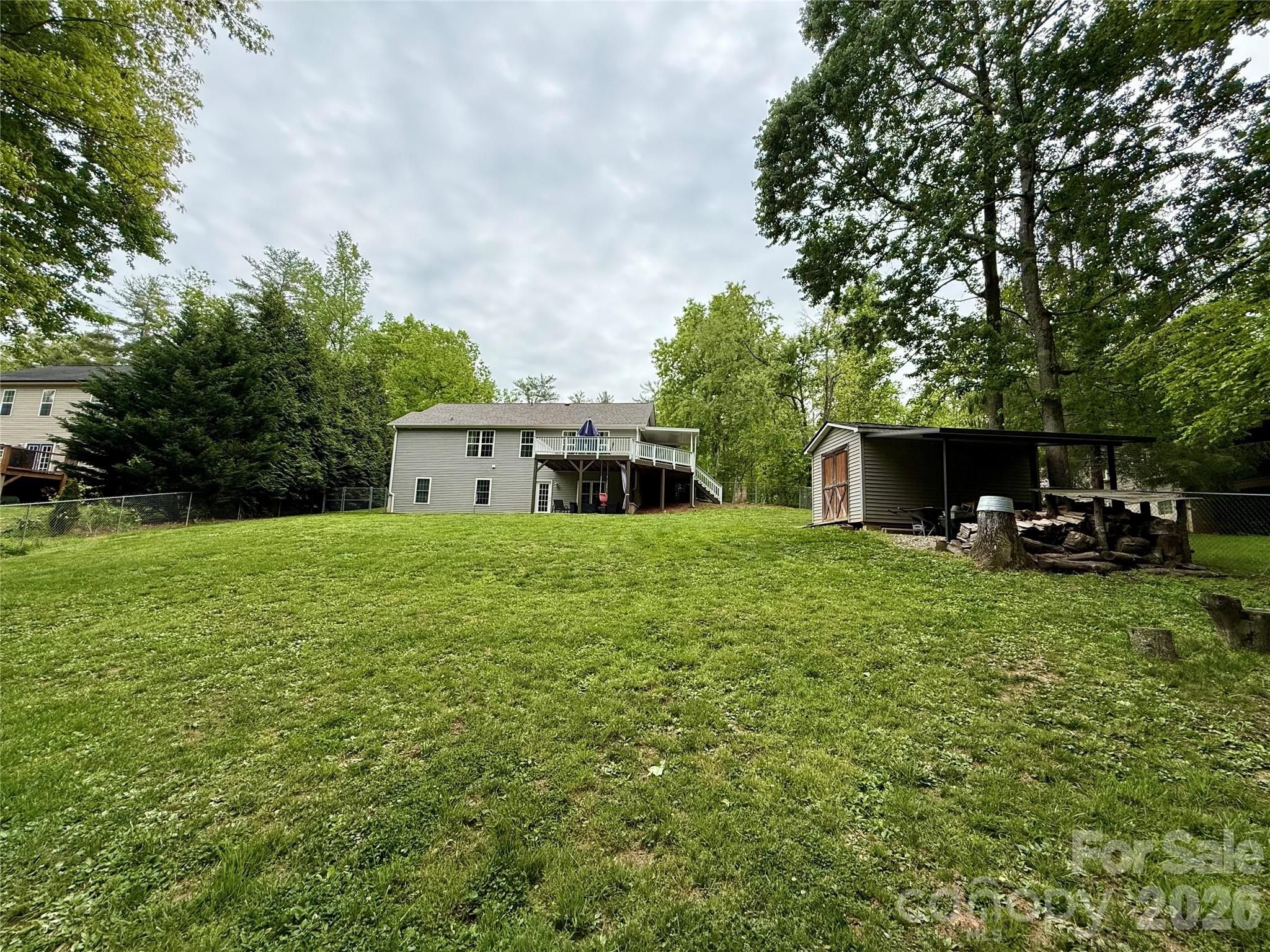 152 Joe Jenkins Road Fairview, NC 28730 - Photo 41 of 44 a front view of a house with a garden