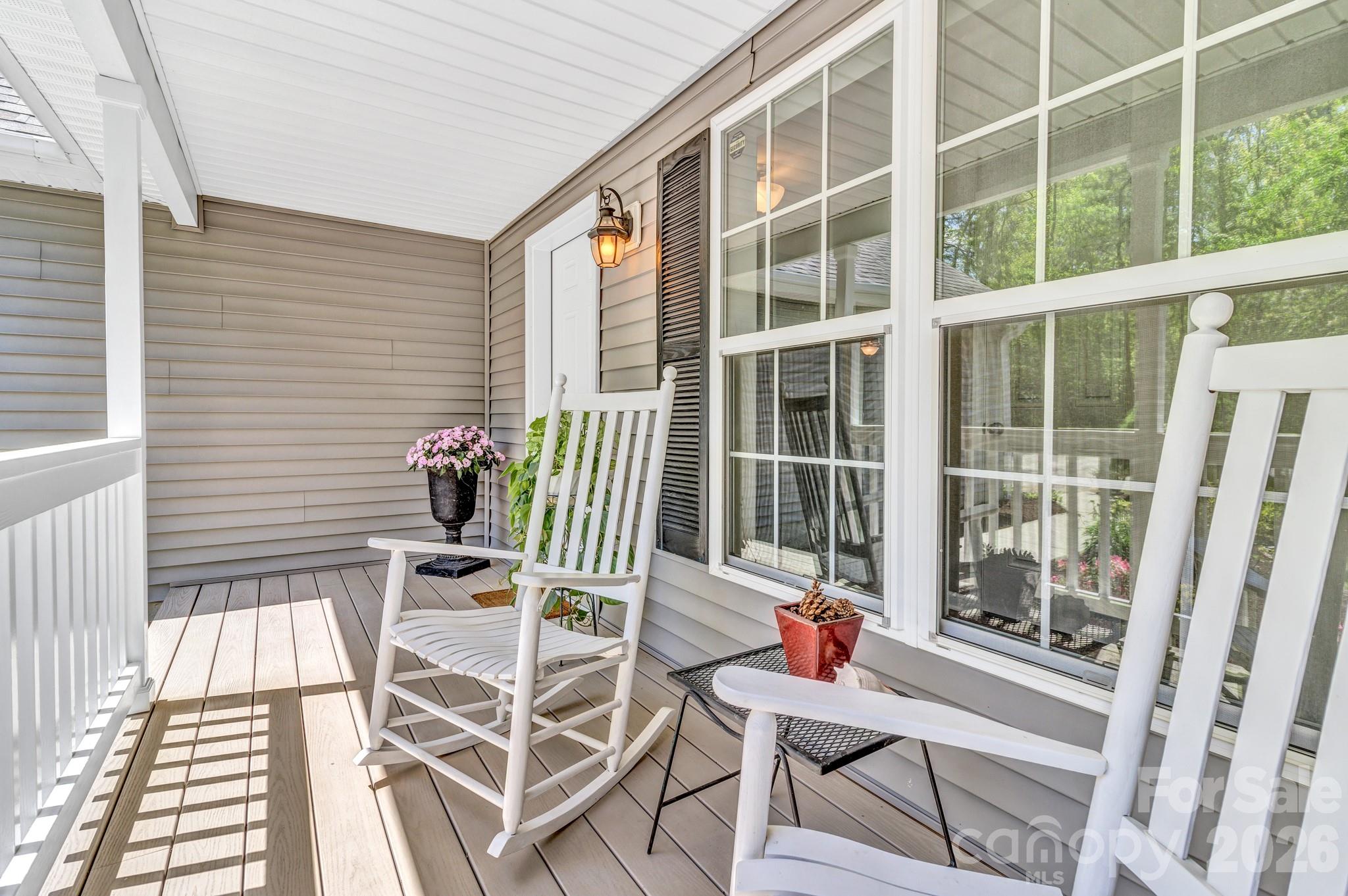 152 Joe Jenkins Road Fairview, NC 28730 - Photo 6 of 44 a balcony with furniture and potted plants