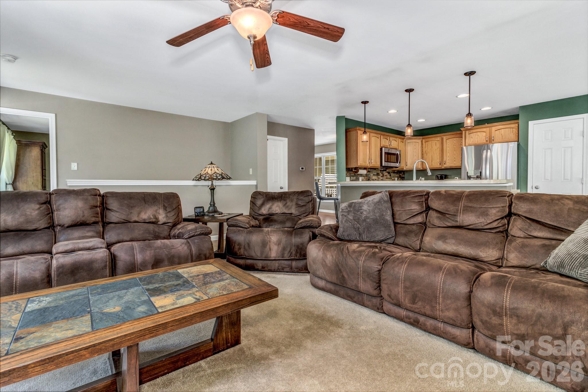 152 Joe Jenkins Road Fairview, NC 28730 - Photo 7 of 44 a living room with furniture and a chandelier