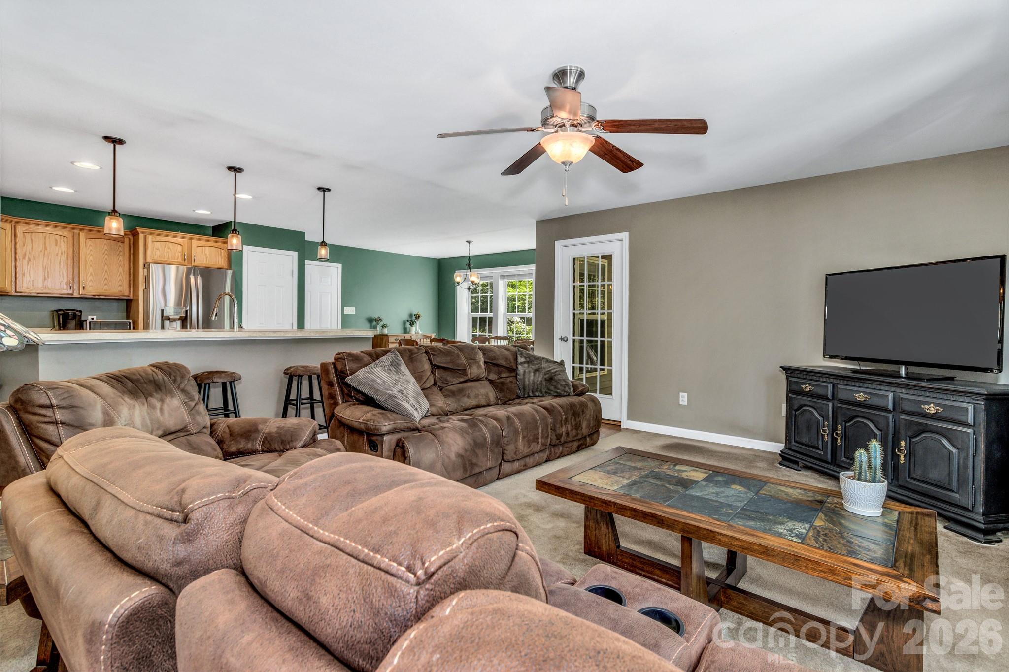 152 Joe Jenkins Road Fairview, NC 28730 - Photo 9 of 44 a living room with furniture flat screen tv and a window