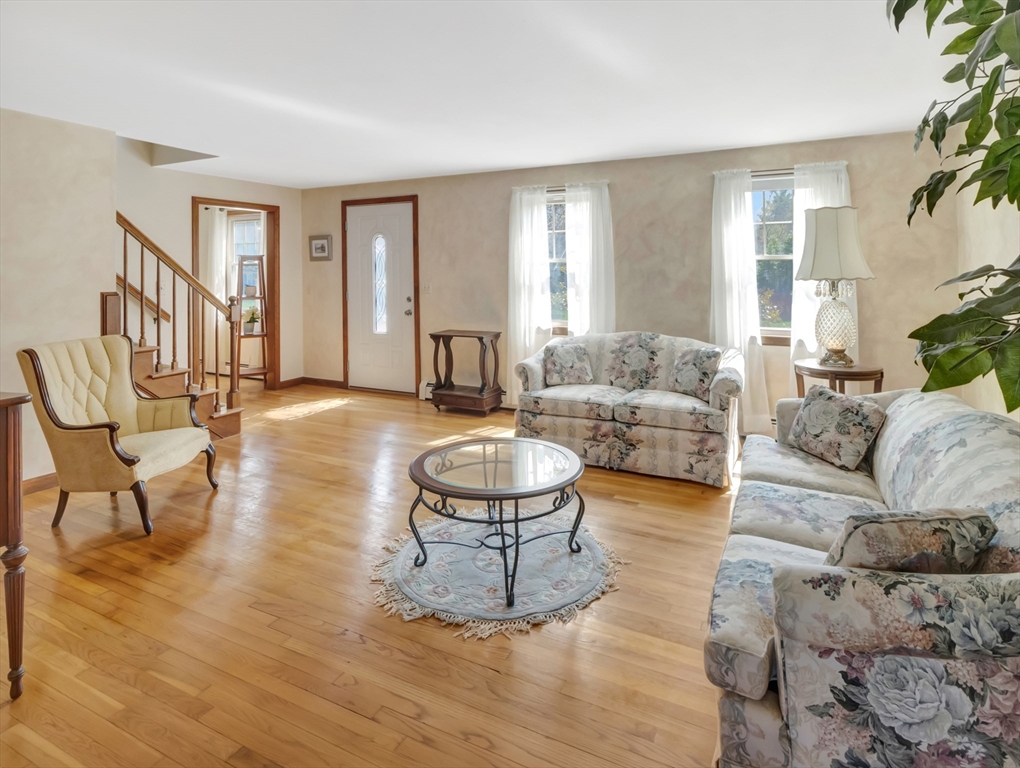 15 Riverside Drive Mansfield, MA 02048 - Photo 10 of 42 a living room with furniture and a large window