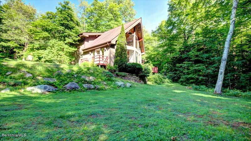 517 Dimmock Road Otis, MA 01253 - Photo 2 of 21 a view of a house with backyard and garden