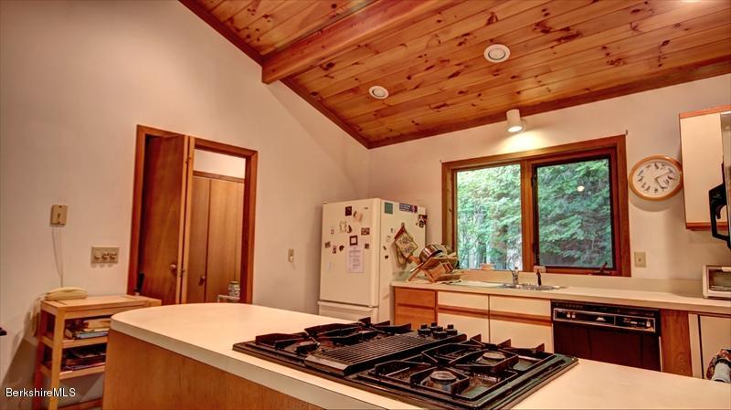 517 Dimmock Road Otis, MA 01253 - Photo 11 of 21 a room with furniture and flat screen tv