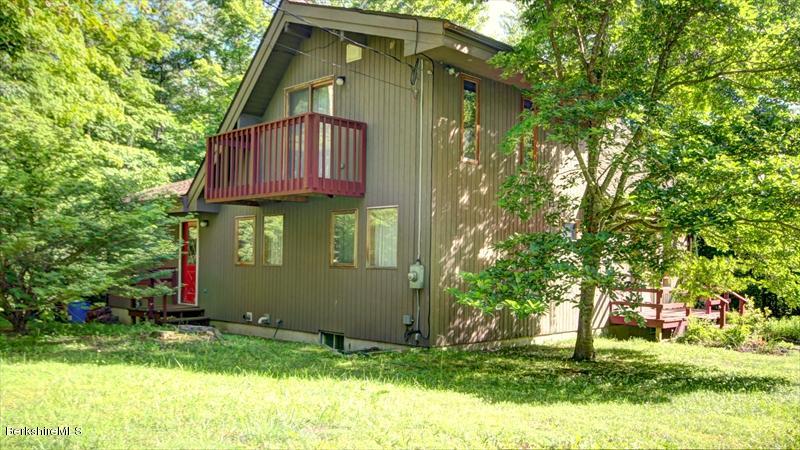 517 Dimmock Road Otis, MA 01253 - Photo 19 of 21 a front view of a house with a yard