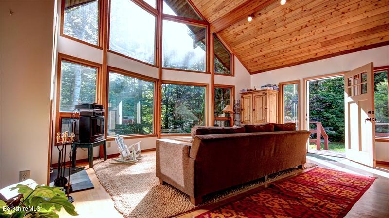 517 Dimmock Road Otis, MA 01253 - Photo 4 of 21 a living room with large windows