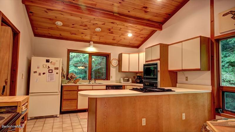 517 Dimmock Road Otis, MA 01253 - Photo 8 of 21 a dining room with large window