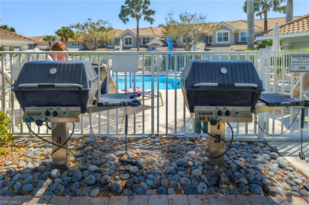 23770 Clear Spring Court, Unit 1408 Estero, FL 34135 - Photo 24 of 33 a view of a chairs and table in the patio