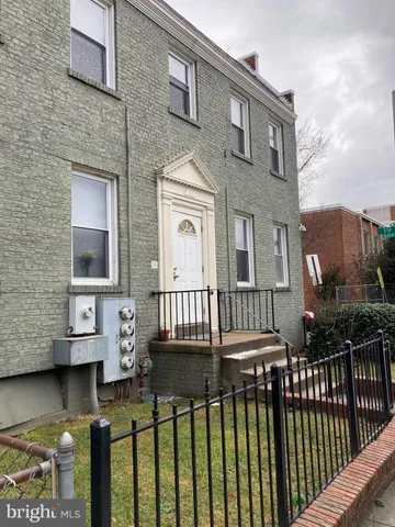 a front view of a house with swimming pool