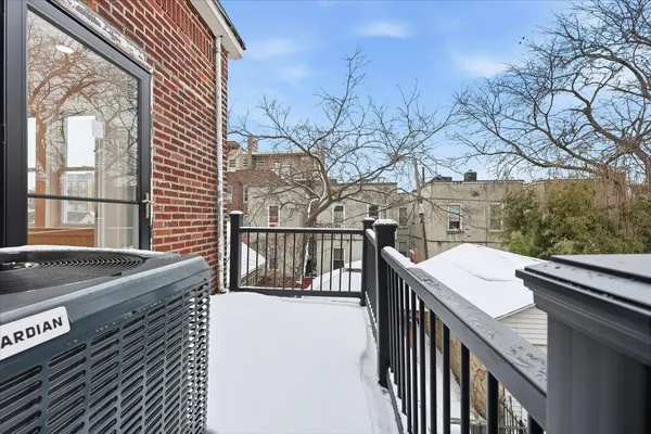 a balcony view with a sink