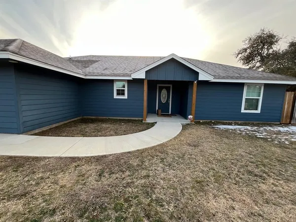 a view of a house with a small yard