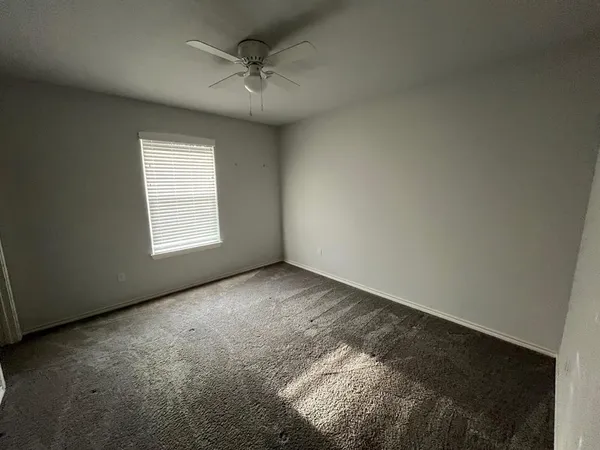an empty room with a empty space and a window
