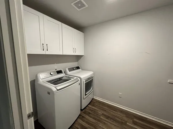 a view of a room with washer and dryer