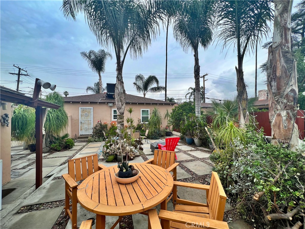 4142 Jurupa Avenue Riverside, CA 92506 - Photo 1 of 1 a view of swimming pool with a table and chairs potted plants