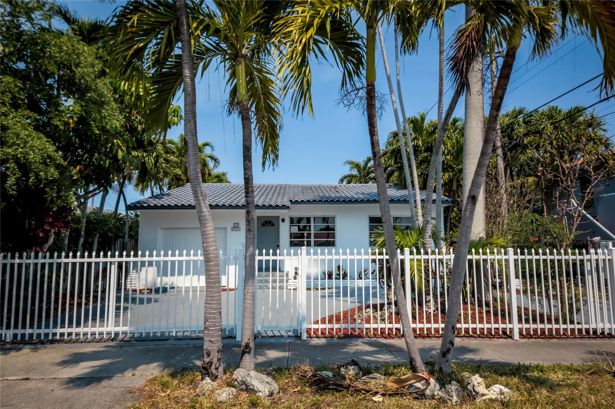 2221 Southwest 13th Street Miami, FL 33145 - Photo 1 of 24 a front view of a house with a garden
