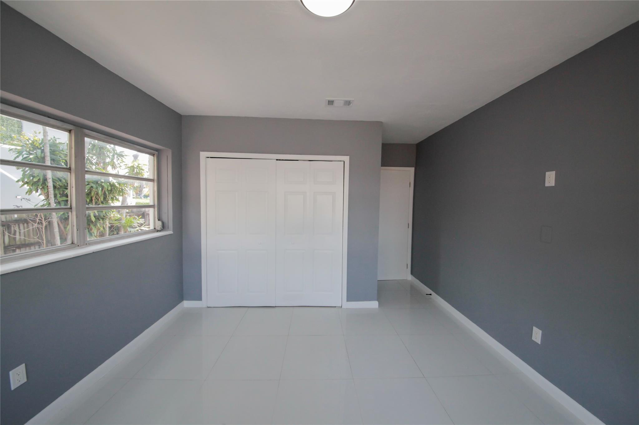2221 Southwest 13th Street Miami, FL 33145 - Photo 13 of 24 an empty room with windows