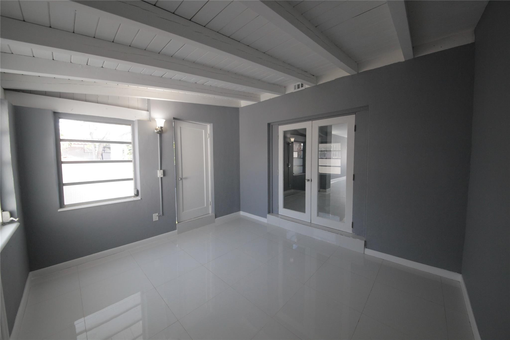 2221 Southwest 13th Street Miami, FL 33145 - Photo 15 of 24 a view of a livingroom with an empty space and window