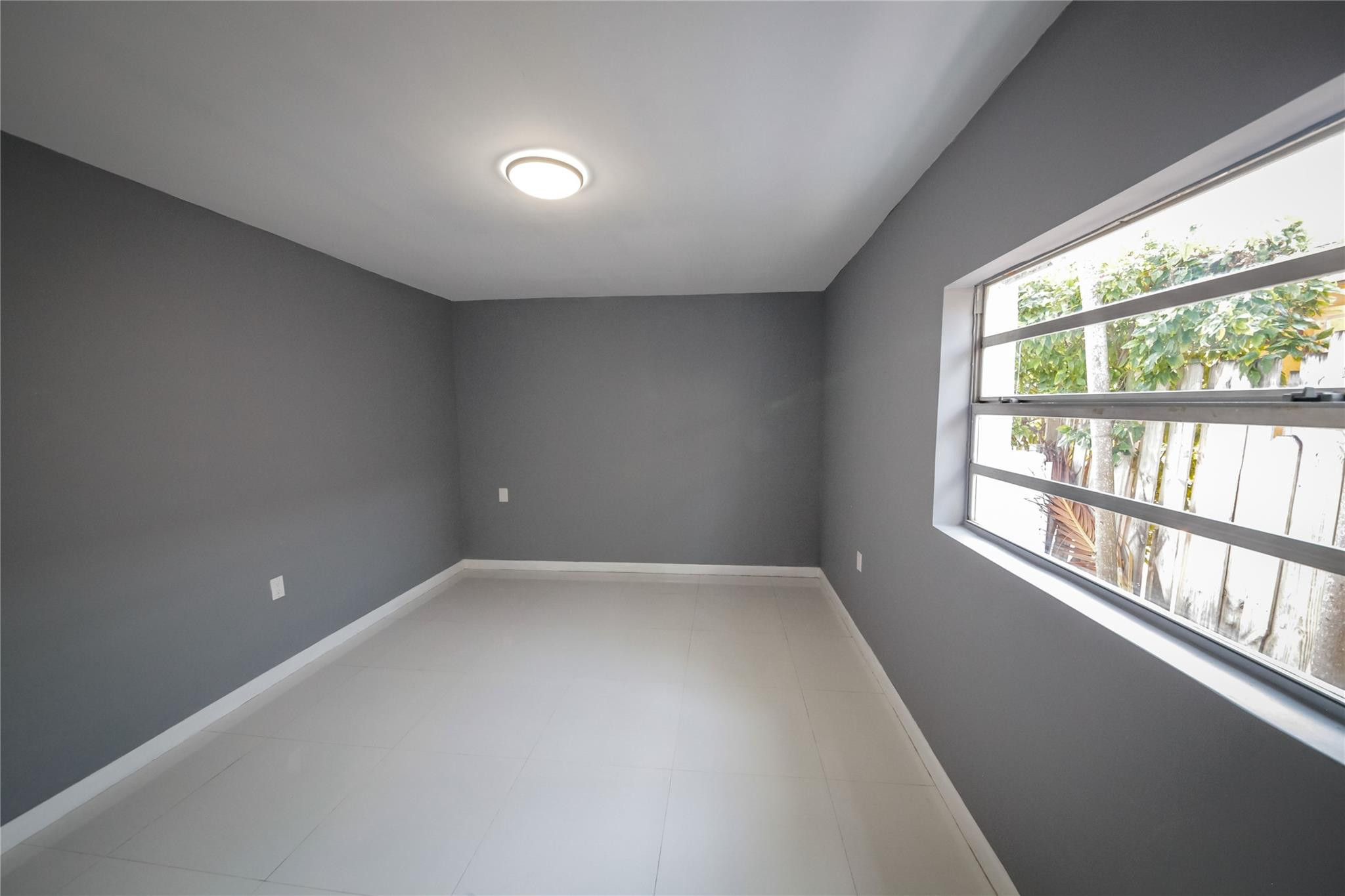 2221 Southwest 13th Street Miami, FL 33145 - Photo 16 of 24 an empty room with wooden floor and windows