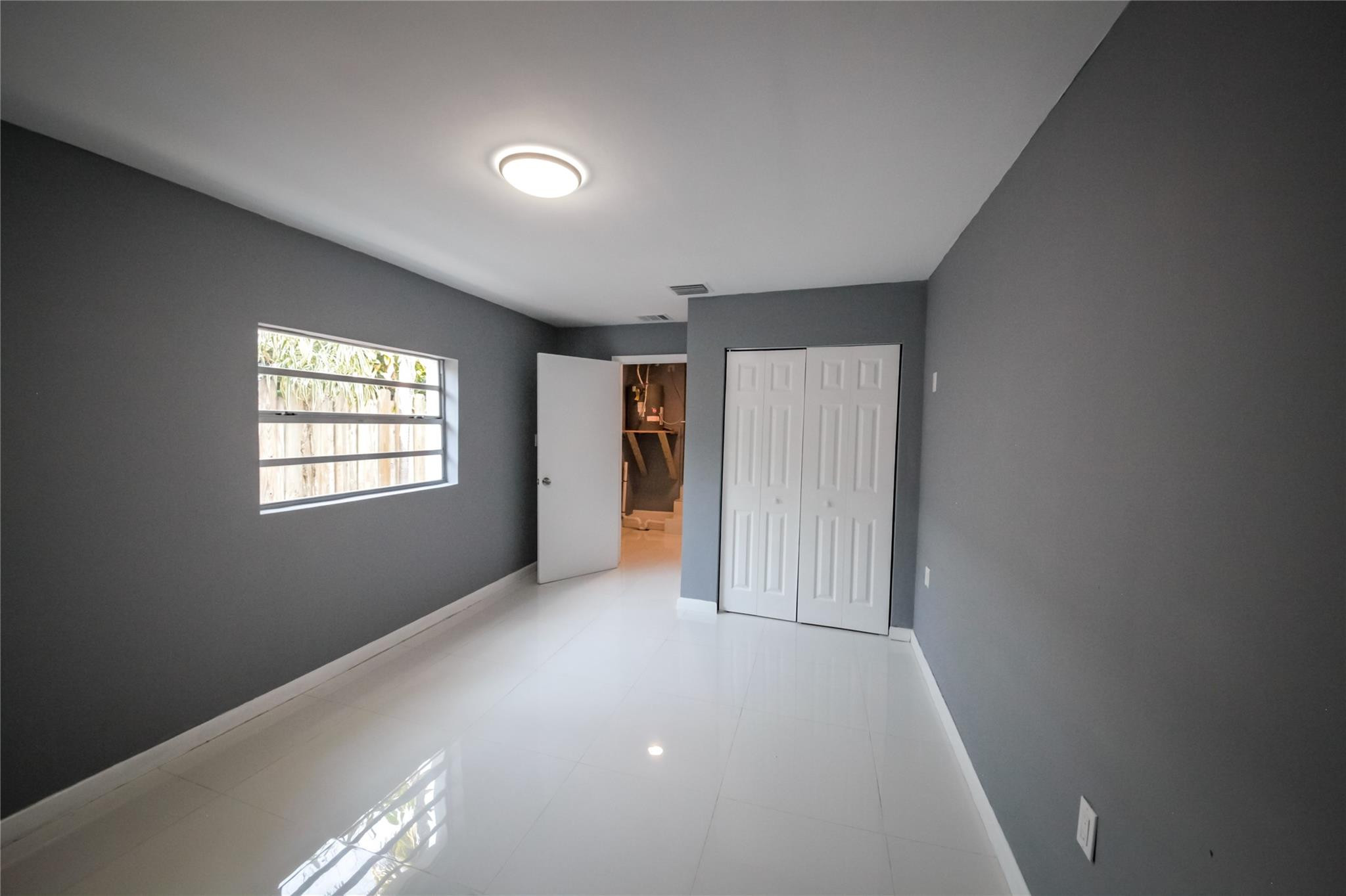 2221 Southwest 13th Street Miami, FL 33145 - Photo 17 of 24 an empty room with windows
