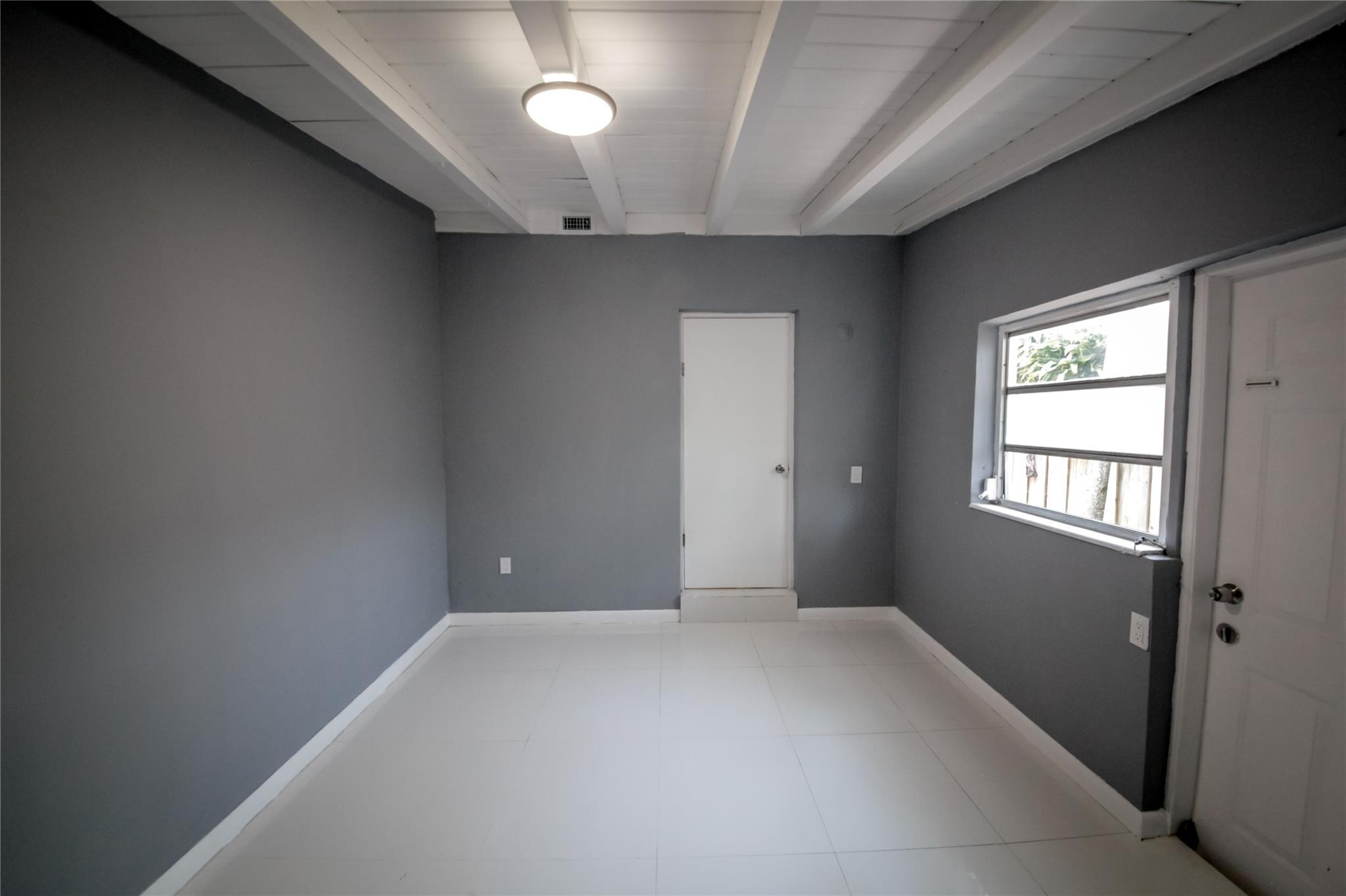 2221 Southwest 13th Street Miami, FL 33145 - Photo 20 of 24 a view of an empty room with a window